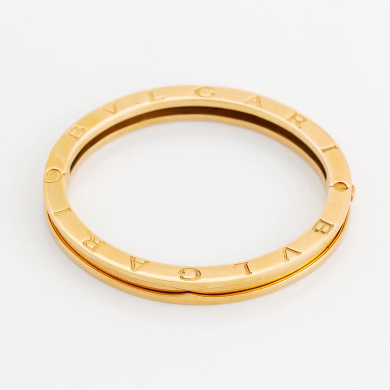 An 18K gold Bulgari bangle.