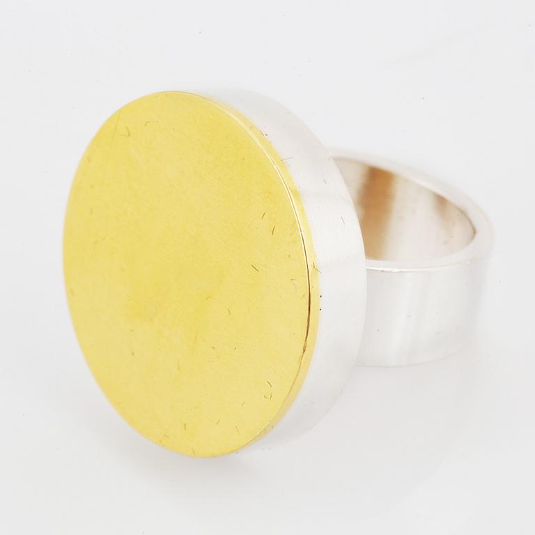 A Hedvig Westermark ring in silver and 18K gold.