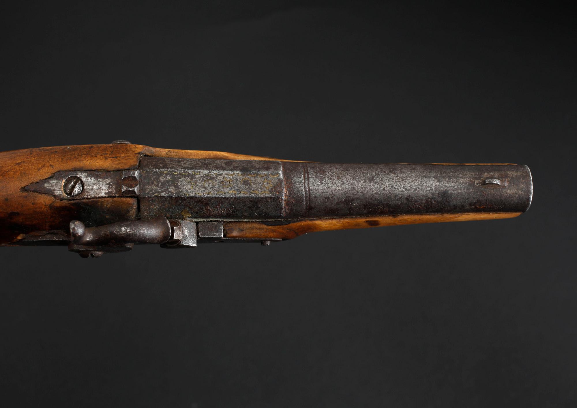 An early 19th century cap lock revolver.