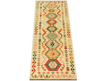 A Kilim runner carpet, c. 291 x 77 cm.