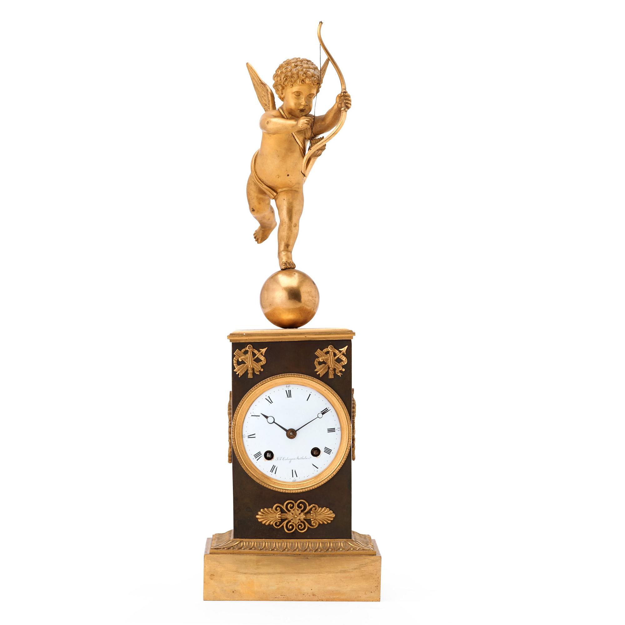 A Swedish Empire gilt and patinated bronze mantel clock by J F Cedergren, clockmaker in Stockholm 1811-1839.