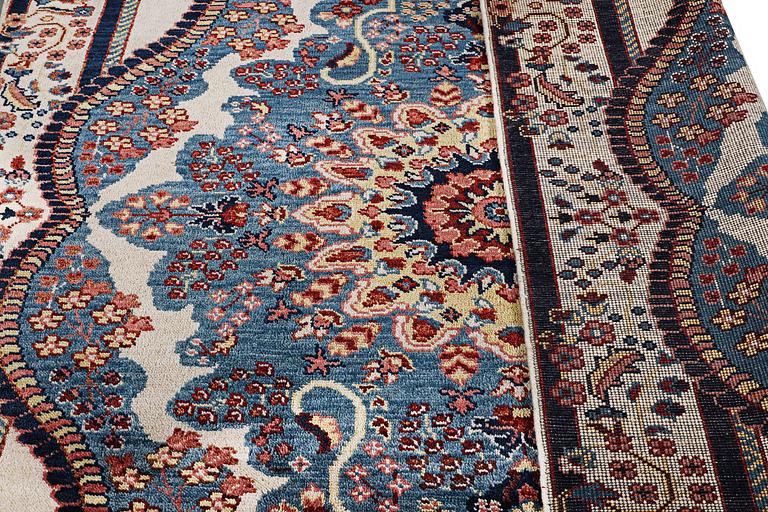 An oriental carpet with Mamluk design, c. 300 x 242 cm.