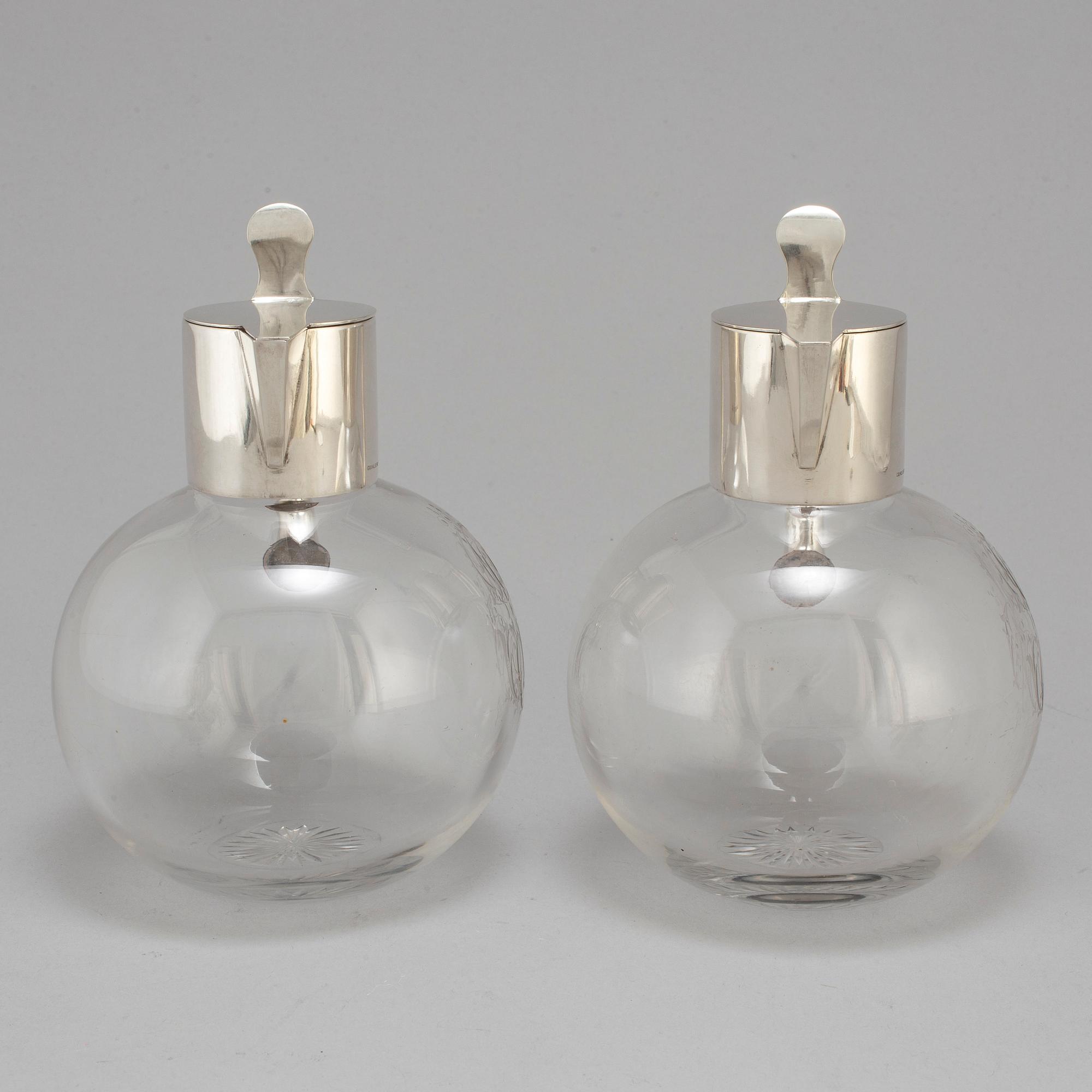 A pair of caraffes with silver mountings by CG Hallberg, Stockholm 1890.