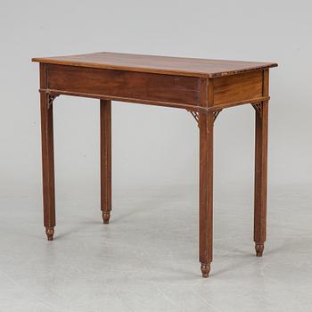 In the manner of the artist, a early 19th century late Gustavian table veneered with mahogany.