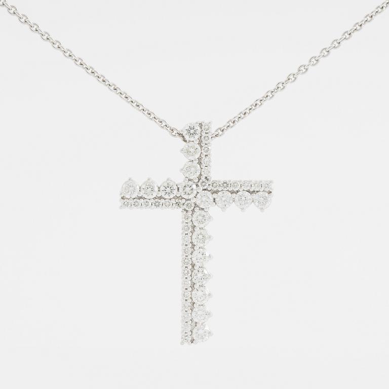 Brilliant cut diamond cross necklace.