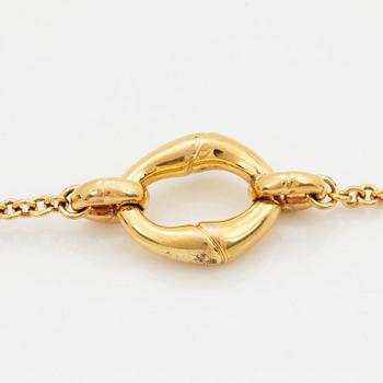 An 18K gold Gucci bracelet.