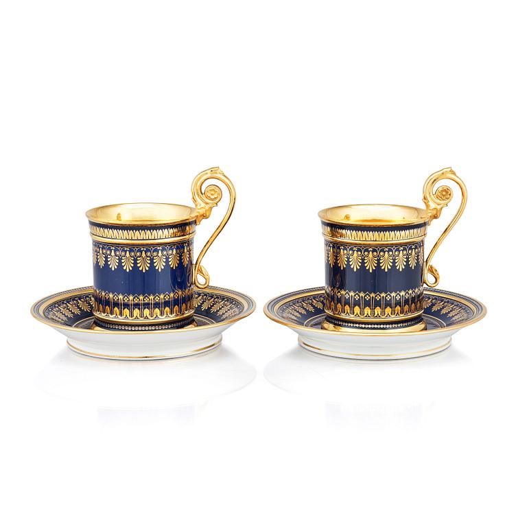 A pair of Sèvres cups with stands, 19th Century.