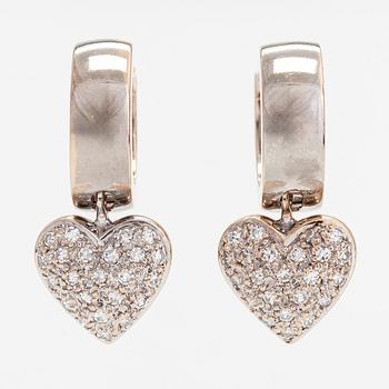 A pair of 14K white gold earrings, with diamondhearts totalling approximately 0.23 ct. Finnish controlmarks.