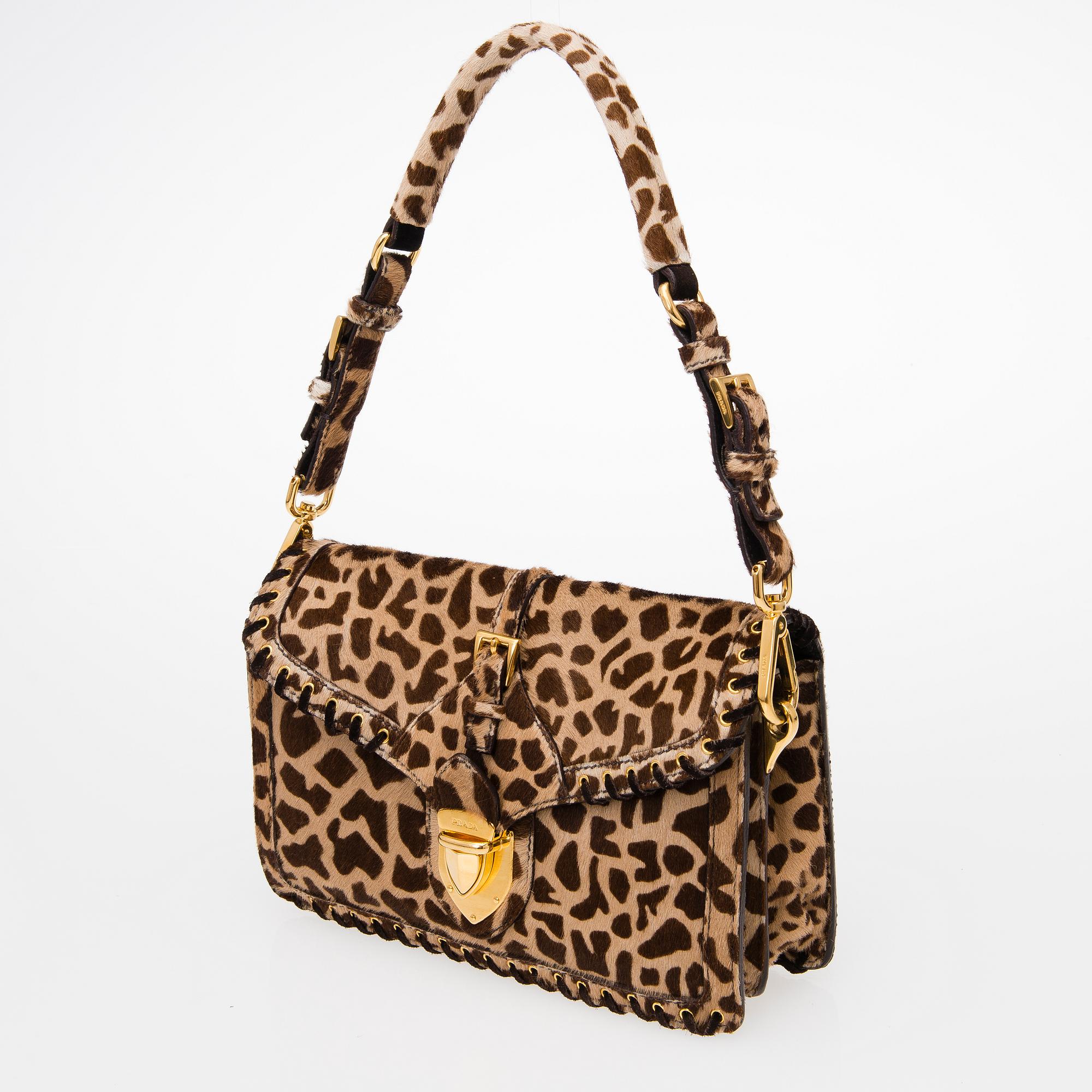 An Animal Print Pony Hair Shoulder Bag.