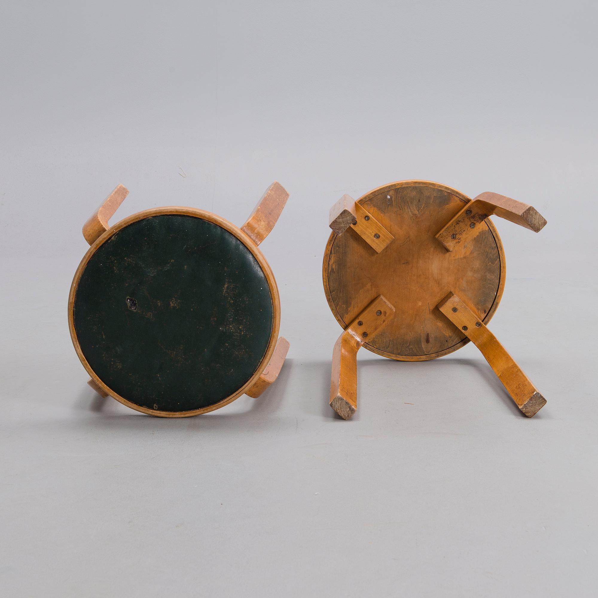 ALVAR AALTO, A PAIR OF STOOLS.