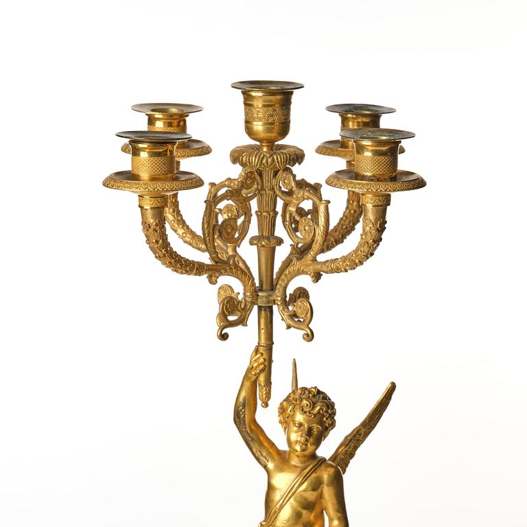 A pair of Empire five lights candelabra.