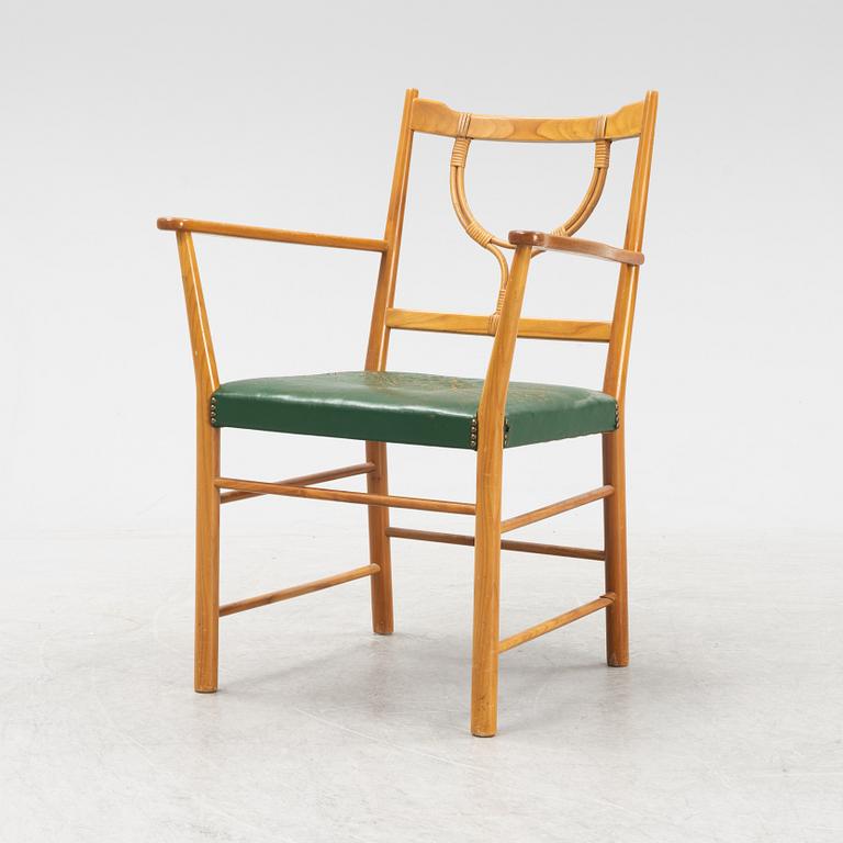 Josef Frank, a model 2238 cherry wood armchair by Firma Svenskt Tenn.