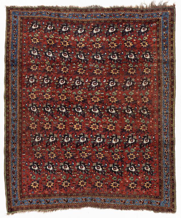 An oriental rug, semi antique, probably Baluch, c. 210 x 170 cm.