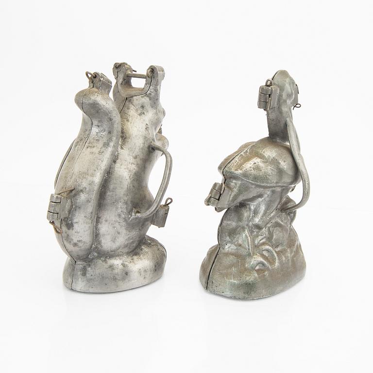 A set of four pewter icecream moulds around 1900.