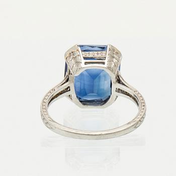 A Shreve & Co Platinum Ring set with a Synthetic Sapphire and Round Brilliant Cut Diamonds.