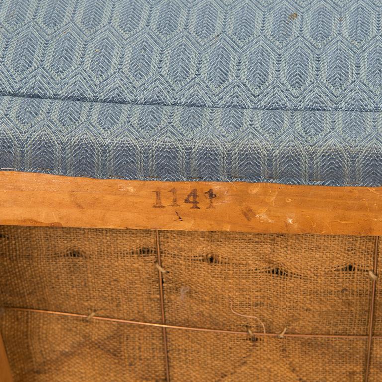 A pair of mid-20th century armchairs.