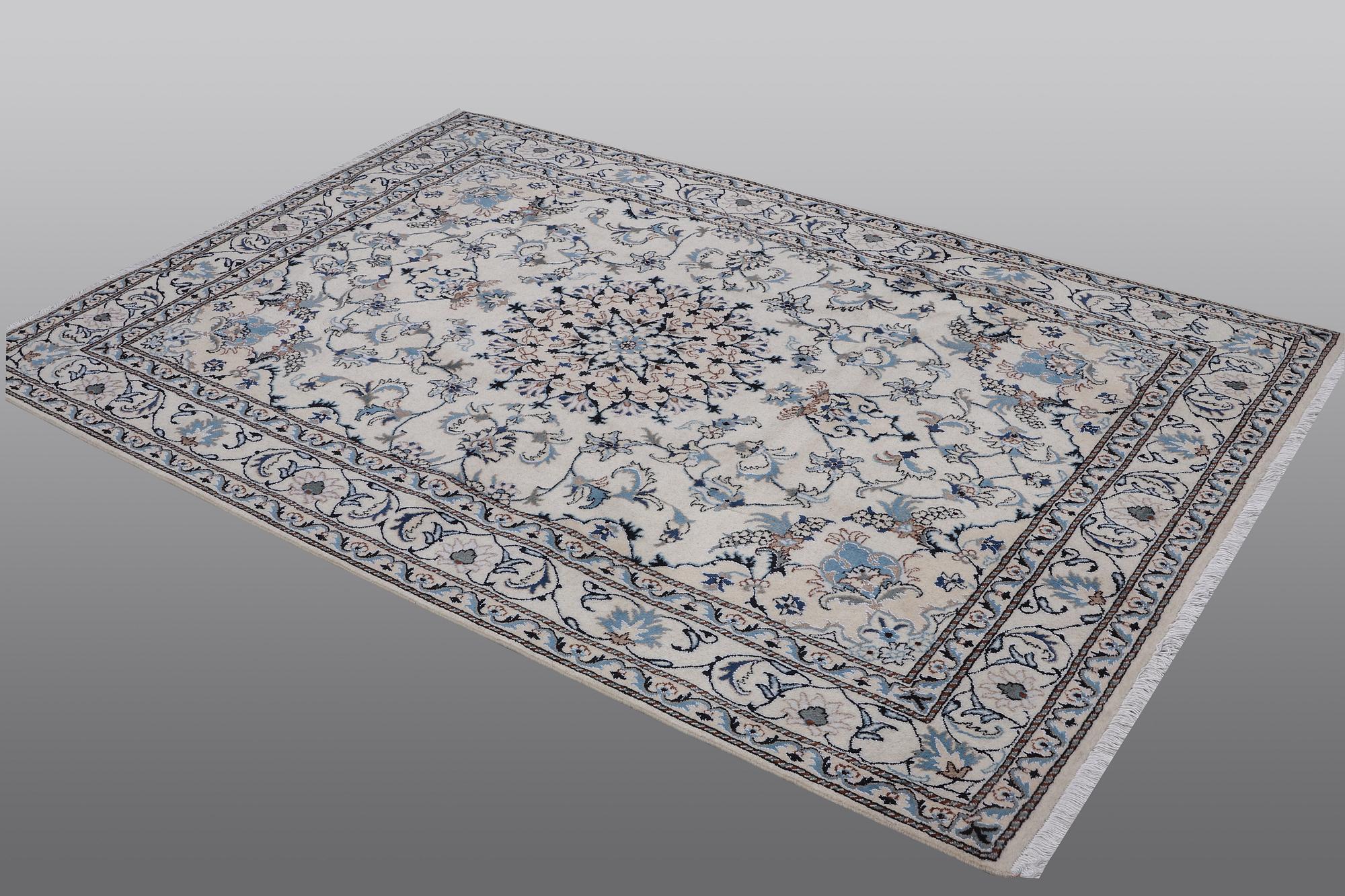 A rug, Nain, part silk, 238 x 163 cm.