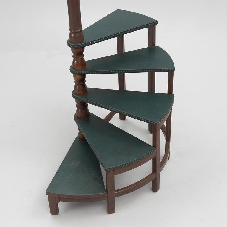 Amid 20th century library ladder.