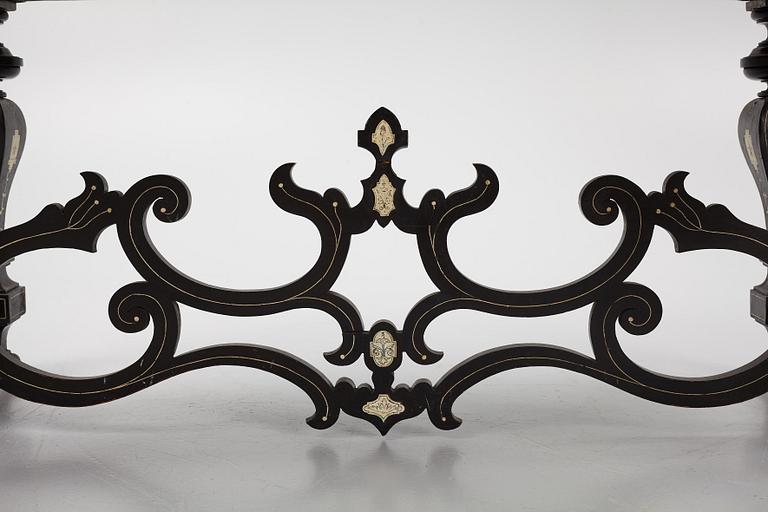 A Renaissance-style ebony, ebonized and ivory-inlaid library table, late 19th century, presumably Germany.