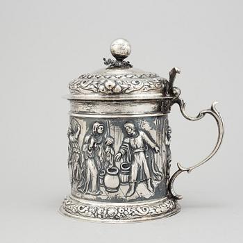 A silver baroque style tankard.