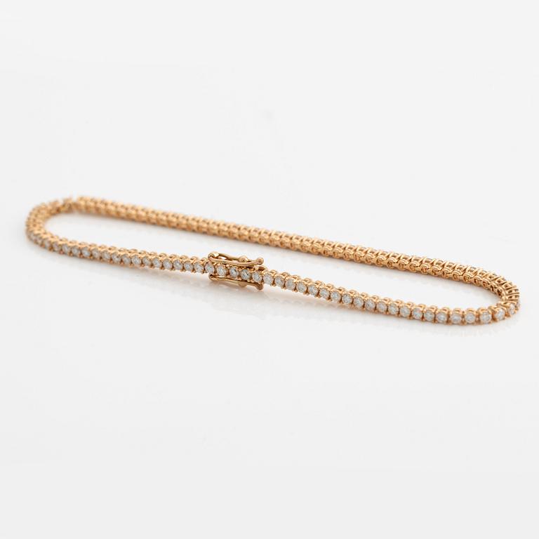 Tennisarmband 14K guld med runda briljantslipade diamanter.