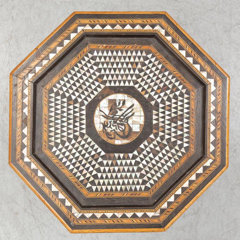 A mother of pearl and wood small table, 20th century.