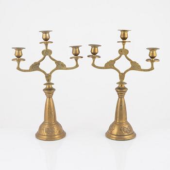 A pair of brass candelabra, Art Nouveau, early 20th century.