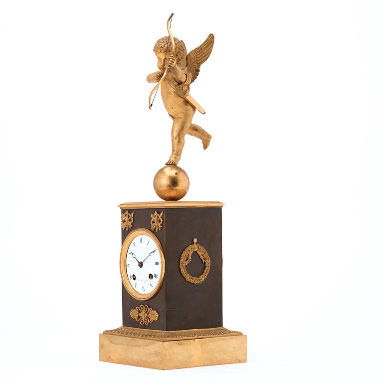 A Swedish Empire gilt and patinated bronze mantel clock by J F Cedergren, clockmaker in Stockholm 1811-1839.
