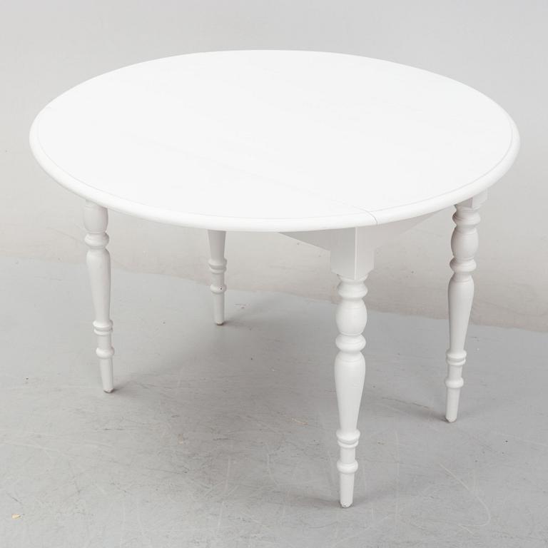 A drop leaf table, 19th Century.