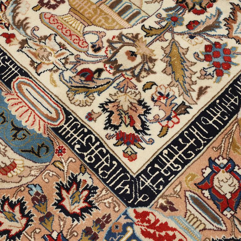 A Kashmar rug, part silk, 396 x 293 cm.