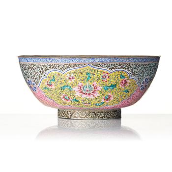 A large enamel on copper bowl, and a cover, Qing dynasty, 18th century.