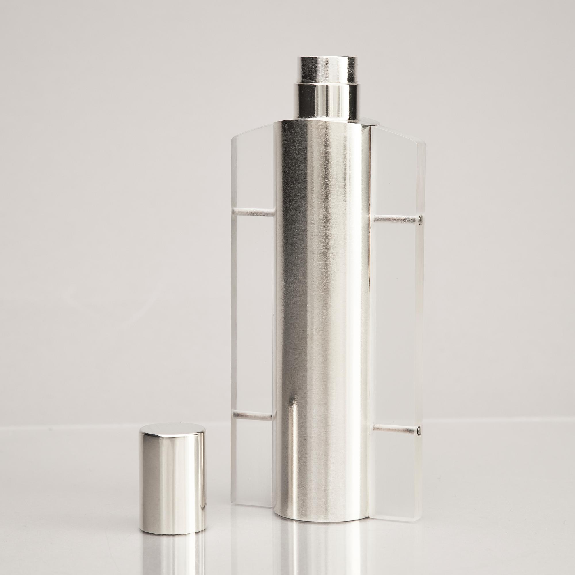 A sterling silver and acrylic bottle with lid, mark of Rolf Lindståhl, Stockholm 2003.