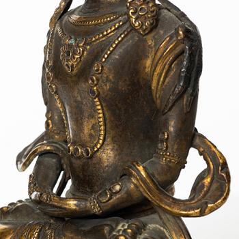 A gilt copper figure of Amitayus, Tibeto-Chinese, 18th Century.