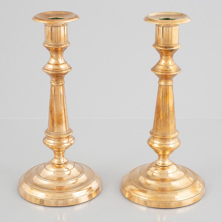 Eight brass candlesticks, including Skultuna Bruk, 19th century.