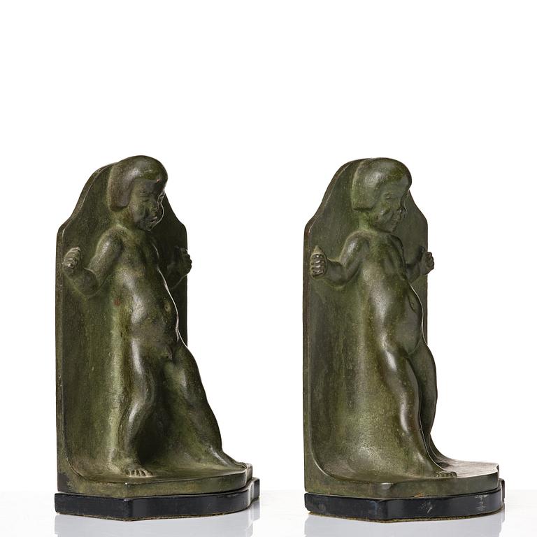 Axel Gute, a pair of green patinated metal bookends, Sweden, dated 1920.