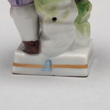 A group of five porcelain figurines of children, Meissen and Vienna.