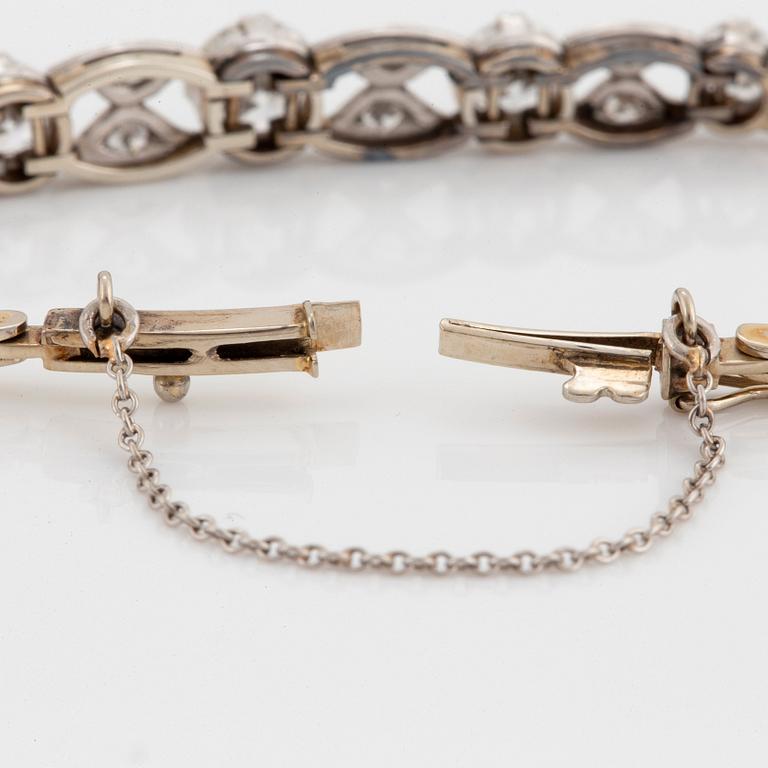 An 18K gold and platinum bracelet set with old- and eight-cut diamonds.