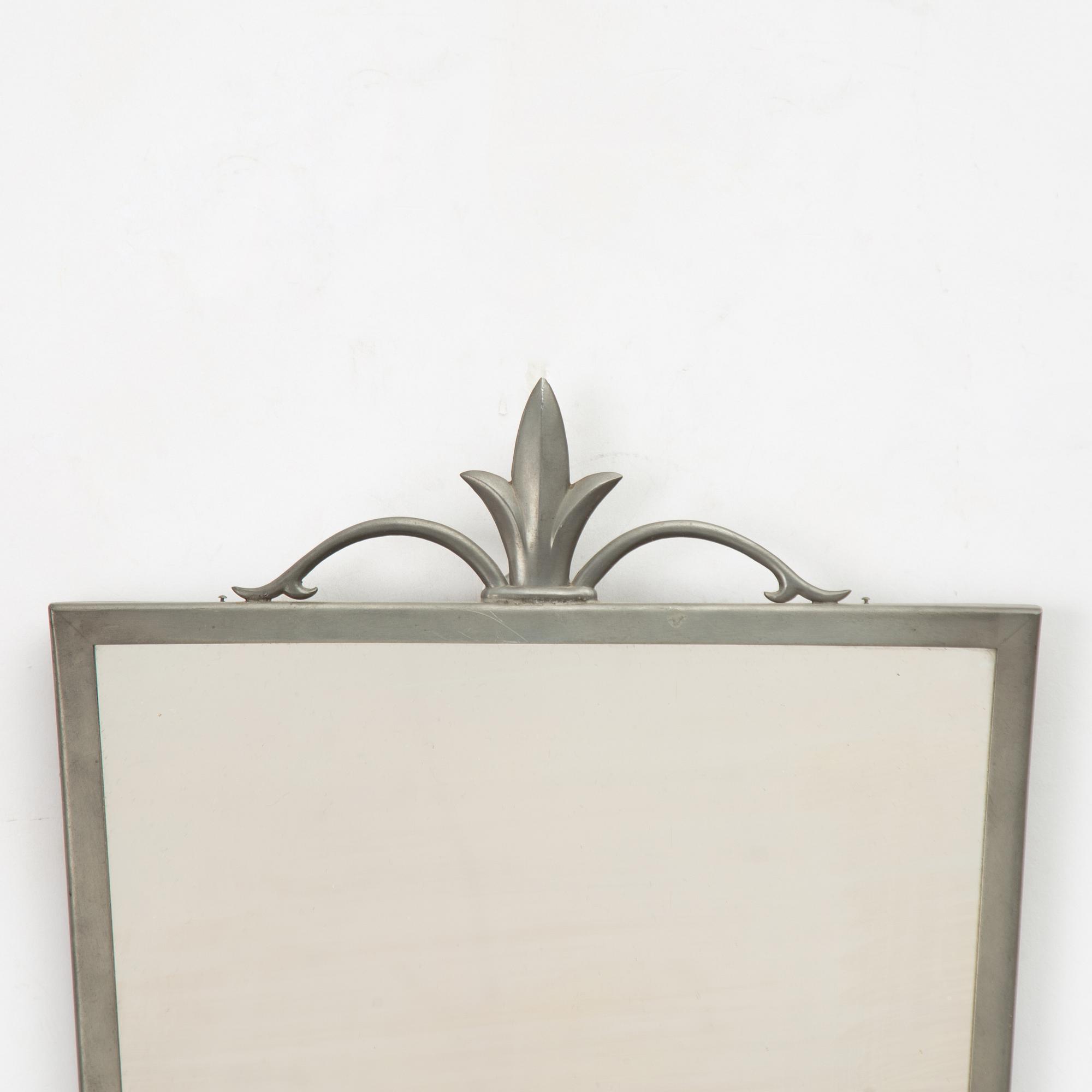 A mirror and pair of wall sconces, Sweden, 1932.