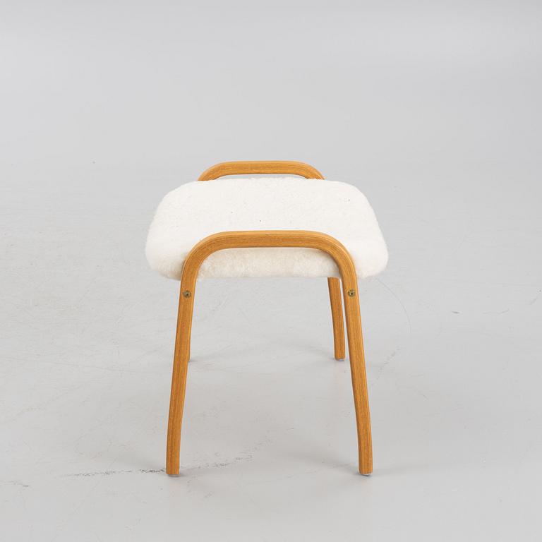 Yngve Ekström, a 'Lamino' armchair and a foot stool, Swedese.