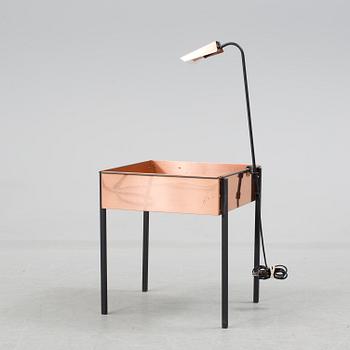 a flower table with a light by Gnosjö konstsmide in the second half of the 20th century.