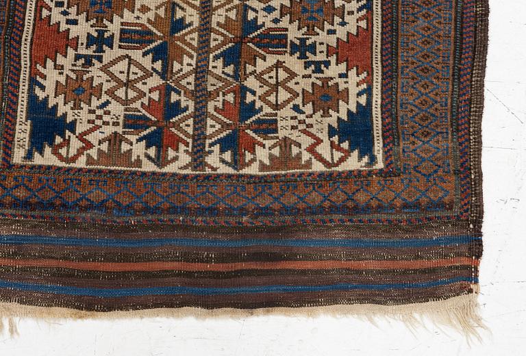 An antique Baluch rug, East Persia, c. 147 x 45 cm.