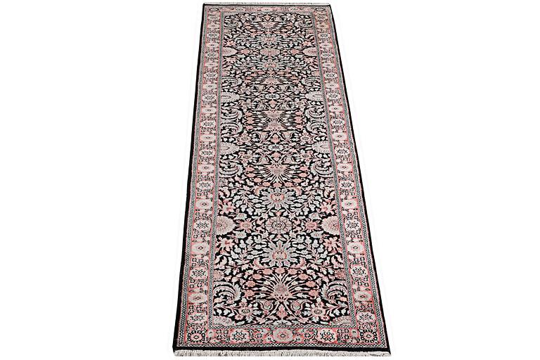 A silk Kashmir runner carpet, c. 305 x 78 cm.