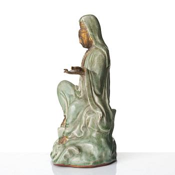 A seated celadon figure of Guanyin, presumably Longquan Ming dynasty, 17th Century.