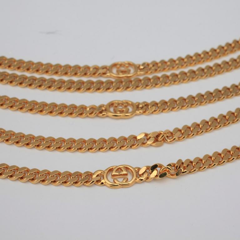 GUCCI, a necklace/belt.