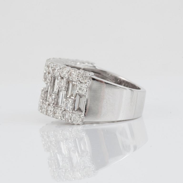 A baguette- and brilliant-cut diamond, ca 3.60 cts, ring.