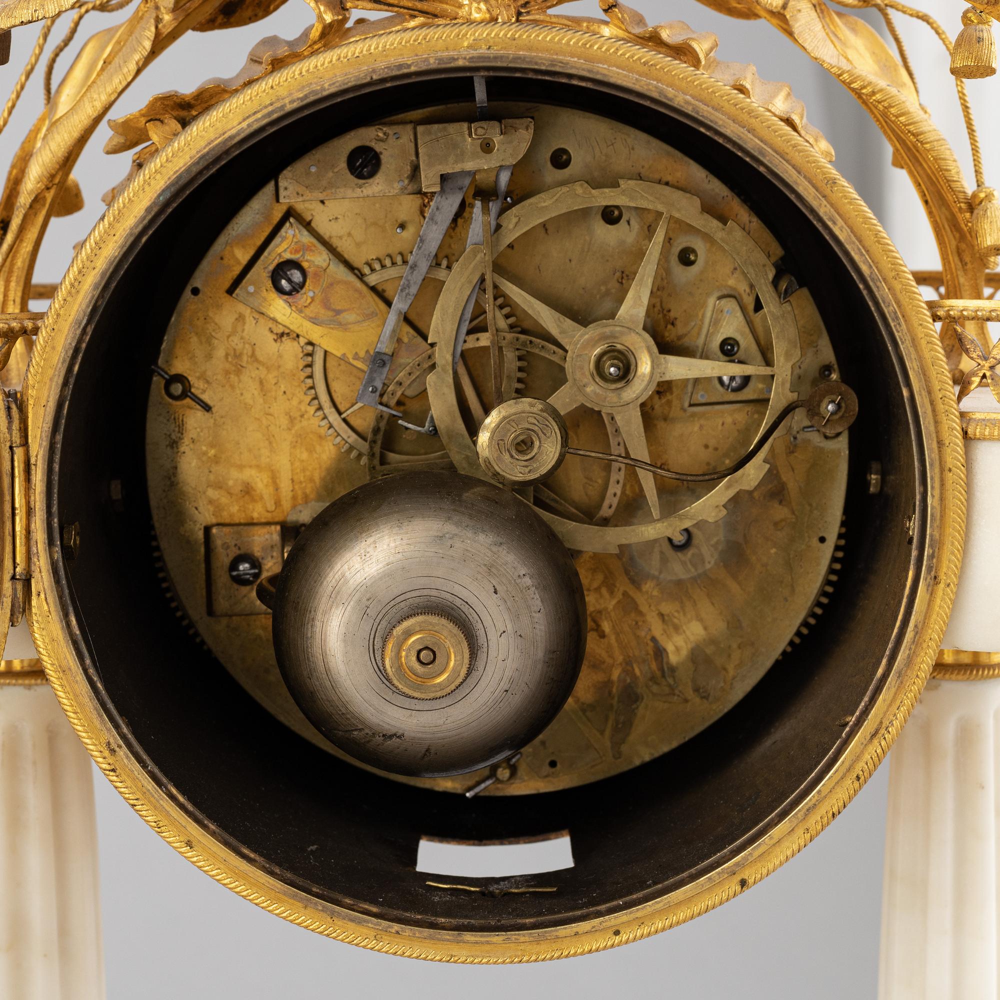 A Louis XVI marble and gilt bronze mantel clock, late 18th Century.