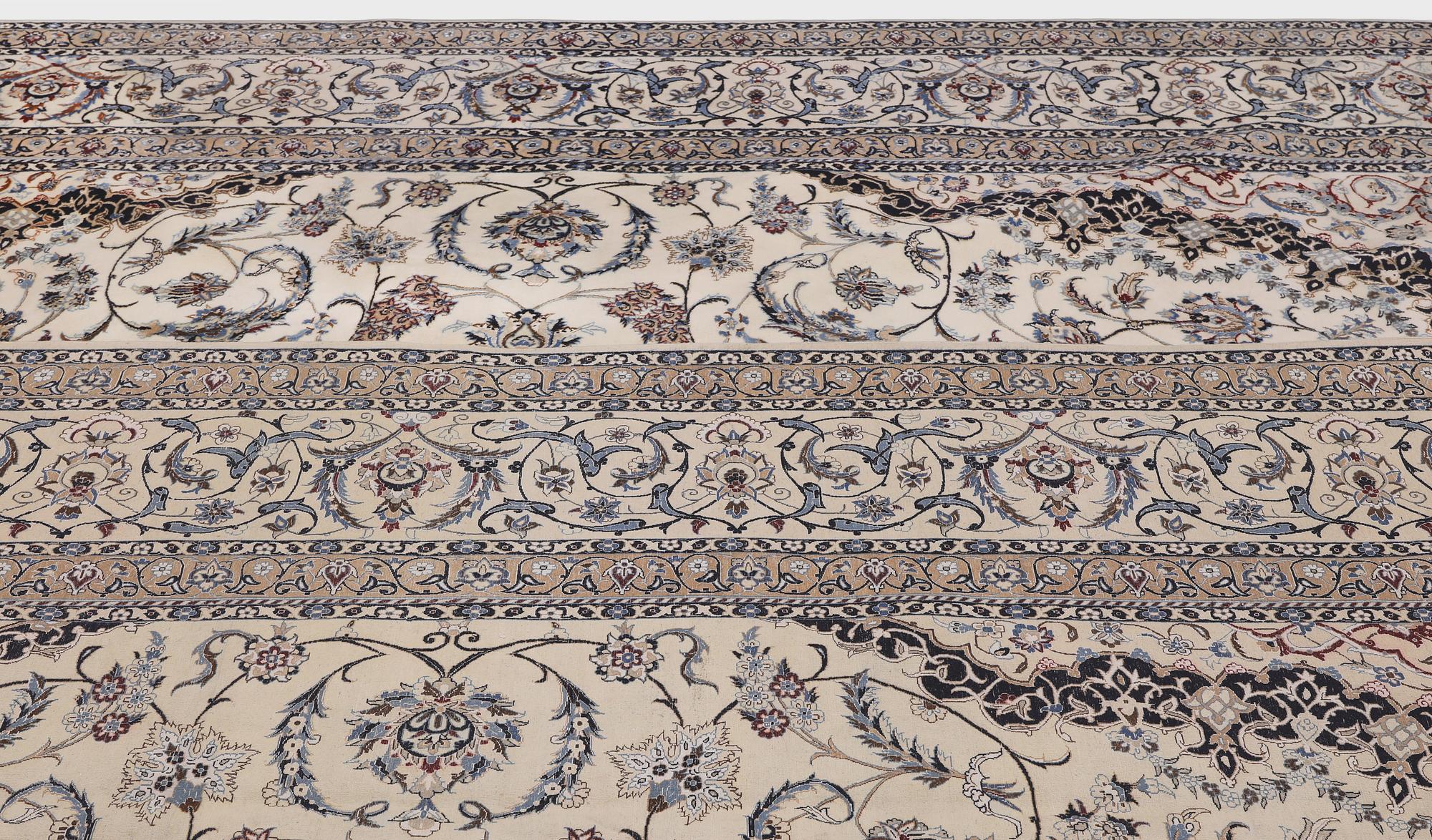 A Nain part silk carpet, 407 x 304 cm.