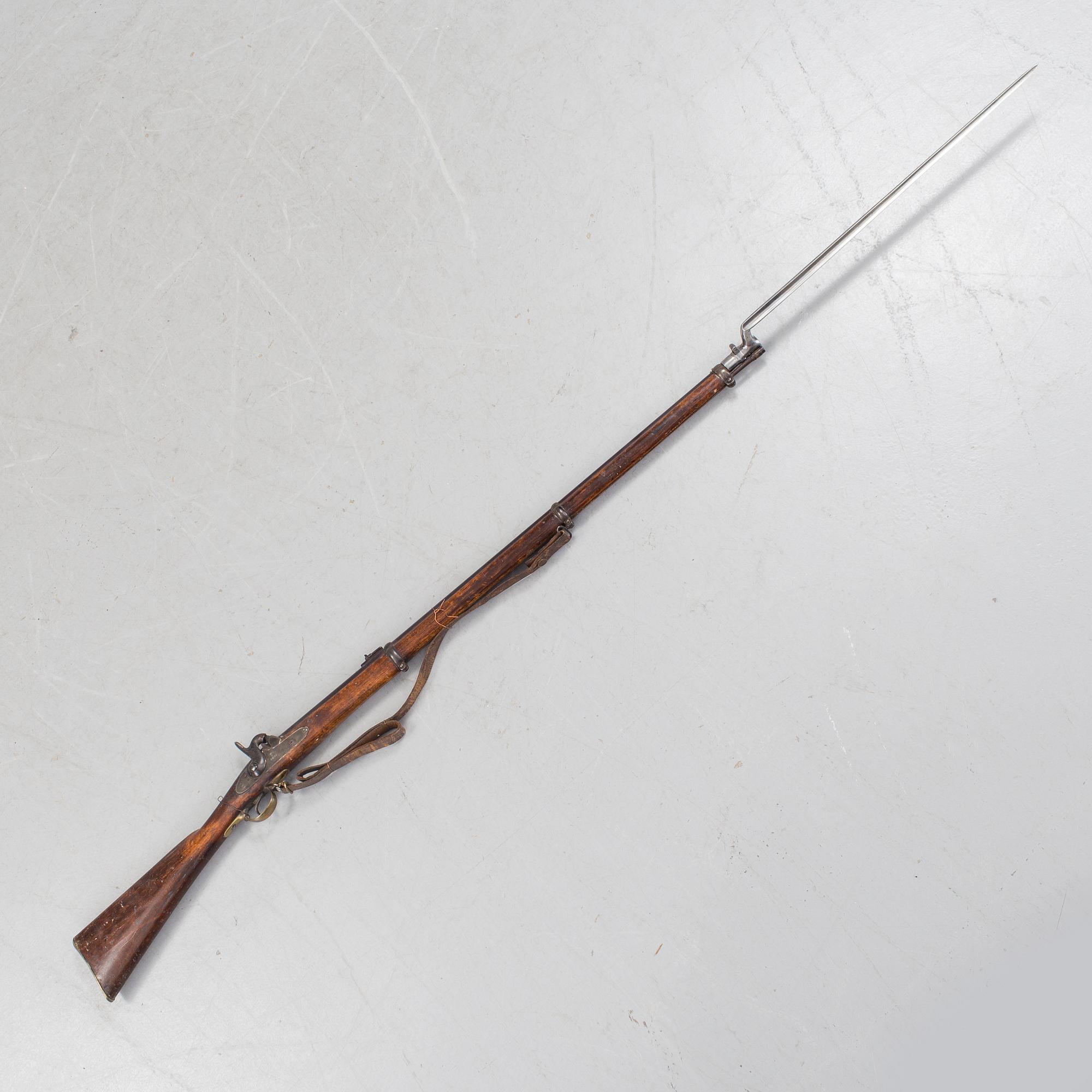 A Swedish 19h Century percussion rifle made by Carl Gustaf stads gevärsfaktori, dated 1851. With bayonet.