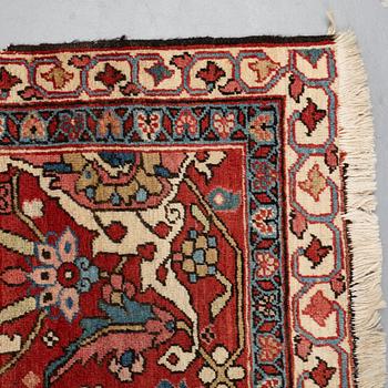 A carpet, an antique Heriz, ca 564,5 x 587,5 x 376,5-380 cm.