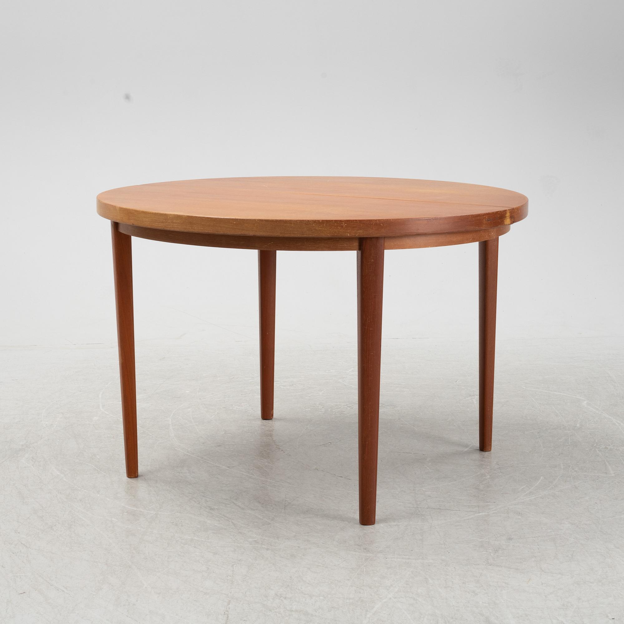 A five-piece teak and oak dining suite, second half of the 20th Century.